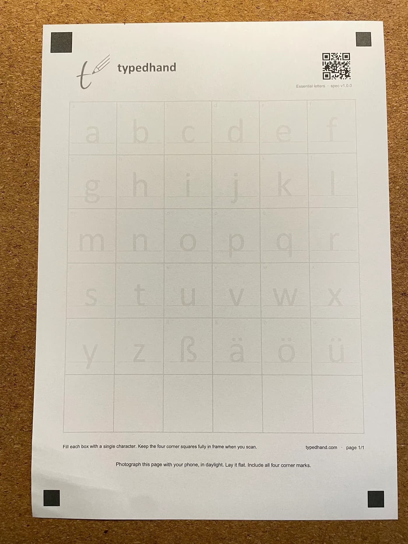 A printed, still empty TypedHand template with its grid of boxes and four corner marks.