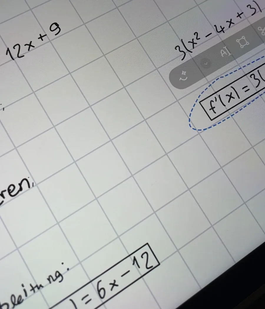 In GoodNotes a lasso selection holds a handwritten term from a derivative and has moved it away from its line.